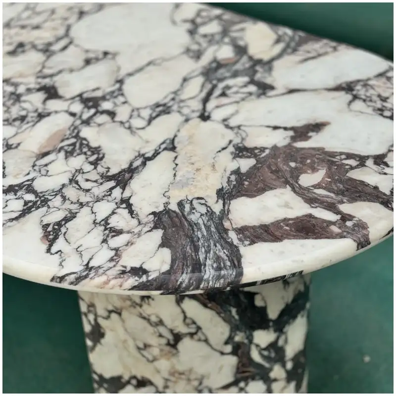Calacatta Viola Marble oval shape table showing rounded tabletop profile and polished marble surface