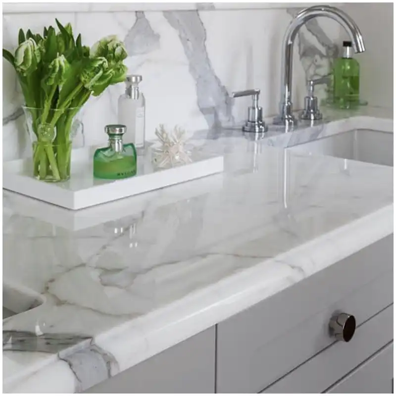 Calacatta marble vanity top vein placement marked around sink cutout faucet holes and backsplash on full slab Calacatta marble vanity top vein placement marked around sink cutout faucet holes and backsplash on full slab