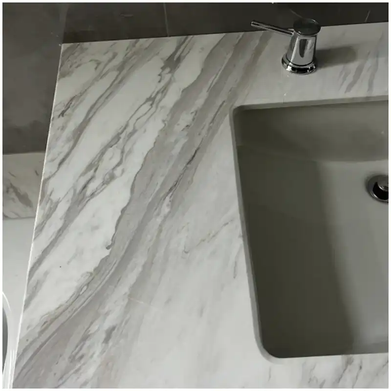 Volakas marble vanity top slab with sink cutout and vein placement overlay Volakas marble vanity top slab with sink cutout and vein placement overlay