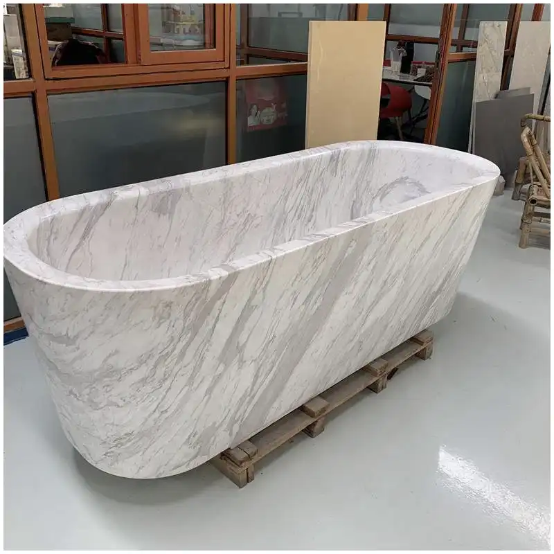 Volakas marble vs Carrara slabs compared under warm and neutral bathroom lighting Volakas marble vs Carrara slabs compared under warm and neutral bathroom lighting